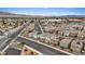 Aerial view of a well-planned community with solar panels and a desert landscape near shopping and city views at 2945 Torreon Ln, Las Vegas, NV 89121