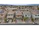 An aerial view shows a row of houses each with driveways and similar architecture, offering a consistent neighborhood feel at 2945 Torreon Ln, Las Vegas, NV 89121
