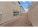 Low-maintenance backyard with gravel and block wall, offering space for outdoor activities at 2945 Torreon Ln, Las Vegas, NV 89121