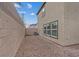 Low-maintenance backyard with gravel landscaping and block wall for privacy at 2945 Torreon Ln, Las Vegas, NV 89121