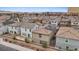 An aerial view showcases home backyards featuring tiled roofs and solar panels in a densely populated neighborhood at 2945 Torreon Ln, Las Vegas, NV 89121