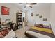 Well-lit bedroom featuring plush carpet, ceiling fan, and decorative wall art at 2945 Torreon Ln, Las Vegas, NV 89121