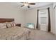 Bedroom featuring a bed, nightstand, window with coverings, and a TV at 2945 Torreon Ln, Las Vegas, NV 89121