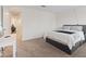 Cozy bedroom with neutral carpet, a queen bed, and an open doorway at 2945 Torreon Ln, Las Vegas, NV 89121