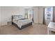 Comfortable bedroom with a queen bed, neutral walls, and natural lighting at 2945 Torreon Ln, Las Vegas, NV 89121