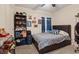 Cozy bedroom with comfortable bed, dark accents and a large window at 2945 Torreon Ln, Las Vegas, NV 89121