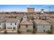 Community with dense housing, tile roofs, solar panels, and commercial areas nearby, showcasing urban living at 2945 Torreon Ln, Las Vegas, NV 89121