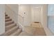Welcoming entryway with carpet, staircase, and white door at 2945 Torreon Ln, Las Vegas, NV 89121