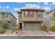 A well-kept two-story home with a neutral palette, two-car garage, and pleasant landscaping at 2945 Torreon Ln, Las Vegas, NV 89121