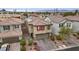 Charming two-story home boasts a red tile roof, solar panels, and a neat front yard landscape at 2945 Torreon Ln, Las Vegas, NV 89121