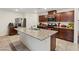 Kitchen featuring granite countertops, stainless steel appliances, and sleek dark wood cabinets at 2945 Torreon Ln, Las Vegas, NV 89121