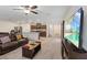 Spacious living area with open floor plan, combining kitchen, dining, and living spaces at 2945 Torreon Ln, Las Vegas, NV 89121