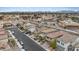 Street view of a neat neighborhood features similar homes with desert landscaping and consistent architectural styles at 2945 Torreon Ln, Las Vegas, NV 89121