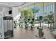 Bright gym overlooking a pool includes cardio equipment, machines, and weights at 322 Karen Ave # 2003, Las Vegas, NV 89109