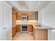 Modern kitchen with wood cabinets, stainless steel appliances and granite countertops at 322 Karen Ave # 2003, Las Vegas, NV 89109