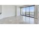 Bright, open living room with marble floors and floor-to-ceiling windows offering panoramic city views at 322 Karen Ave # 2003, Las Vegas, NV 89109