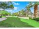 Private putting green surrounded by lush landscaping at 322 Karen Ave # 2003, Las Vegas, NV 89109