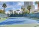Well-maintained tennis court surrounded by lush landscaping for recreational enjoyment at 322 Karen Ave # 2003, Las Vegas, NV 89109