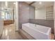 Elegant bathroom with a modern soaking tub and large mirror at 3722 Las Vegas Blvd # 1204, Las Vegas, NV 89158