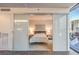 Bedroom with sliding glass doors, neutral decor, and city view at 3722 Las Vegas Blvd # 1204, Las Vegas, NV 89158