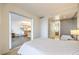 Bedroom featuring ensuite bath, kitchen access, and light neutral decor at 3722 Las Vegas Blvd # 1204, Las Vegas, NV 89158