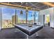 Game room with a pool table and expansive city views through large windows at 3722 Las Vegas Blvd # 1204, Las Vegas, NV 89158
