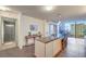 Modern kitchen featuring breakfast bar, stainless steel appliances, and views of the city skyline at 3722 Las Vegas Blvd # 1204, Las Vegas, NV 89158