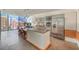 Modern kitchen featuring stainless steel appliances, island, and expansive windows offering stunning city views at 3722 Las Vegas Blvd # 1204, Las Vegas, NV 89158