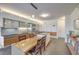 Contemporary kitchen and dining area featuring sleek cabinets, island, and counter seating at 3722 Las Vegas Blvd # 1204, Las Vegas, NV 89158
