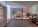 Contemporary living room featuring floor-to-ceiling windows with a stunning view of the city skyline at night at 3722 Las Vegas Blvd # 1204, Las Vegas, NV 89158