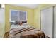 Bright bedroom with neutral tones, large window, and closet with sliding door at 3747 N Braewood South Ave, Las Vegas, NV 89120