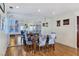 Bright dining area with mirrored wall, wood floors, and view into the living area at 3747 N Braewood South Ave, Las Vegas, NV 89120