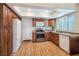 Updated kitchen with stainless steel appliances, granite countertops, and wood cabinets at 3747 N Braewood South Ave, Las Vegas, NV 89120