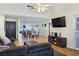 Open-concept living room with wood floors, vaulted ceilings, and ample natural light at 3747 N Braewood South Ave, Las Vegas, NV 89120