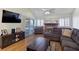 Inviting living room with a fireplace, plush seating, and natural light at 3747 N Braewood South Ave, Las Vegas, NV 89120