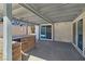 Covered patio with an outdoor kitchen area and sliding glass doors, perfect for entertaining at 3747 N Braewood South Ave, Las Vegas, NV 89120