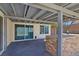 The covered patio offers a brick outdoor kitchen, and easy access through sliding glass doors at 3747 N Braewood South Ave, Las Vegas, NV 89120