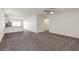 Spacious living room with new carpet, neutral walls, and an open layout at 4249 Gold Desert St, North Las Vegas, NV 89032