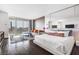 Bright bedroom has a sitting area with city views, large windows and hardwood floors at 4381 W Flamingo Rd # 3712, Las Vegas, NV 89103