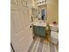 Cozy bathroom with a blue vanity, white toilet, and a stylish rug at 4534 Regalo Bello St, Las Vegas, NV 89135