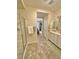 Bathroom featuring a glass-enclosed shower, white vanity, and neutral tile flooring at 4534 Regalo Bello St, Las Vegas, NV 89135