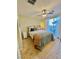 Comfortable bedroom with soft lighting and a sliding glass door leading to the backyard at 4534 Regalo Bello St, Las Vegas, NV 89135