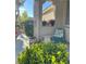 Charming front porch with decorative plants and a cozy seating area creating a welcoming entrance at 4534 Regalo Bello St, Las Vegas, NV 89135