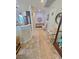 Open hallway flows into the kitchen, featuring stylish decor and a neutral color palette at 4534 Regalo Bello St, Las Vegas, NV 89135