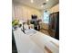 Modern kitchen features white cabinets, stainless steel appliances, and a sleek faucet at 4534 Regalo Bello St, Las Vegas, NV 89135