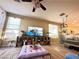 Spacious living room featuring a large TV, stylish furnishings, and ample natural light at 4534 Regalo Bello St, Las Vegas, NV 89135