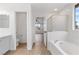 Bright bathroom with soaking tub, shower, and vanity with tile flooring at 4905 Madre Maria Ct, North Las Vegas, NV 89031