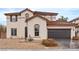 Charming two-story home with a tile roof, attached garage, and low-maintenance landscaping at 4905 Madre Maria Ct, North Las Vegas, NV 89031