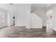 Open-concept living space showcasing modern wood-look floors and ample space for entertaining at 4905 Madre Maria Ct, North Las Vegas, NV 89031