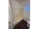 Bathroom with shower-tub combination with wood look flooring at 5129 Sugarfoot Ave, Las Vegas, NV 89107
